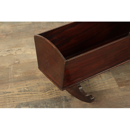 841 - A GEORGE III MAHOGANY DOLLS CRADLE with shaped sides raised on rockers. (67cm wide )