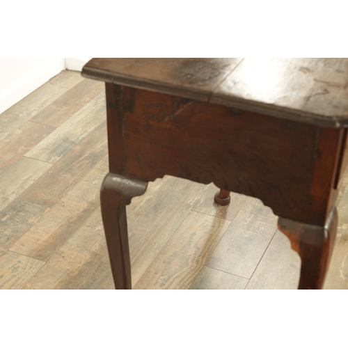 845 - AN 18TH CENTURY OAK LOWBOY with moulded edge top above three drawers and shaped frieze; raised on ca... 