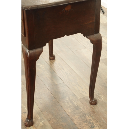 845 - AN 18TH CENTURY OAK LOWBOY with moulded edge top above three drawers and shaped frieze; raised on ca... 