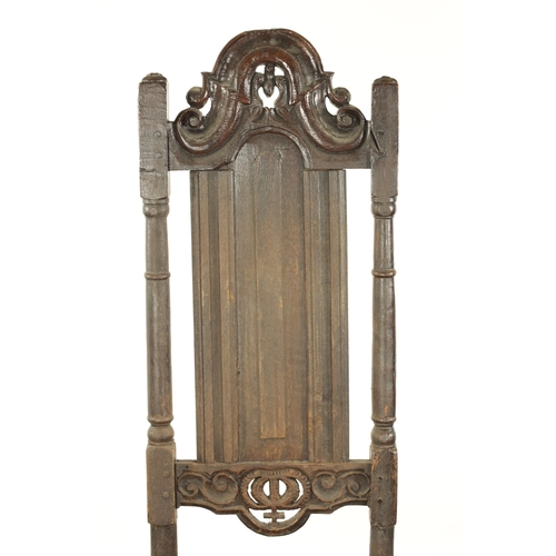 846 - A 17TH CENTURY TALL PANEL BACK JOINED OAK SIDE CHAIR with scrolled arched pierced cresting, turned u... 