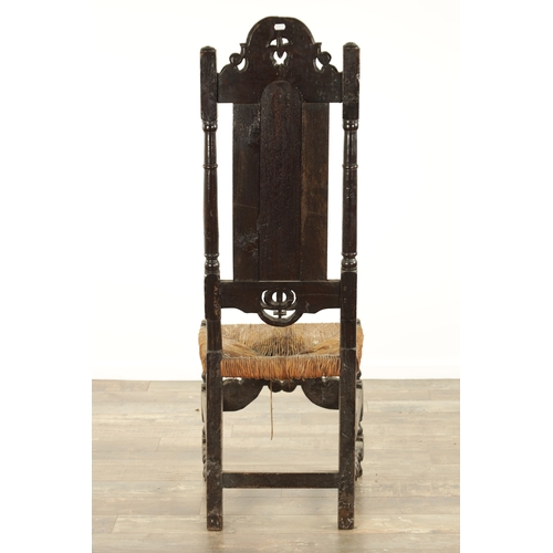 846 - A 17TH CENTURY TALL PANEL BACK JOINED OAK SIDE CHAIR with scrolled arched pierced cresting, turned u... 