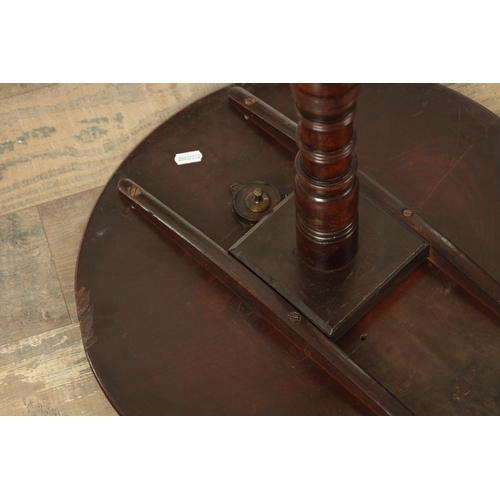 848 - A GEORGE III MAHOGANY TILT-TOP TABLE with ring-turned stem and tripod base. (46cm diameter 77cm high... 