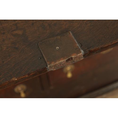 849 - AN EARLY PRIMITIVE 17TH CENTURY JOINED OAK BUREAU with shallow fall front and fitted small drawers a... 