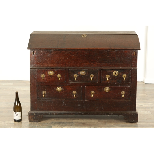 849 - AN EARLY PRIMITIVE 17TH CENTURY JOINED OAK BUREAU with shallow fall front and fitted small drawers a... 