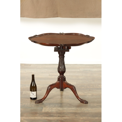 853 - A 19TH CENTURY MAHOGANY IRISH STYLE TILT-TOP TABLE with a shaped moulded edge top above, bulbous tur... 