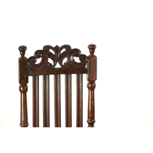 854 - A PAIR OF 17TH CENTURY OAK HALL CHAIRS with scroll-carved top rails above slatted backs, having upho... 