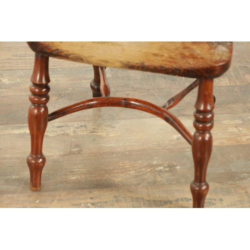 856 - A 19TH CENTURY CHILD'S YEW WOOD WINDSOR CHAIR with shaped cut-out back splat, saddle seat and turned... 