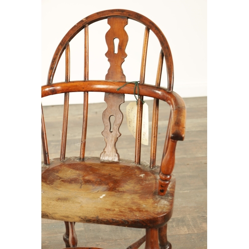 856 - A 19TH CENTURY CHILD'S YEW WOOD WINDSOR CHAIR with shaped cut-out back splat, saddle seat and turned... 