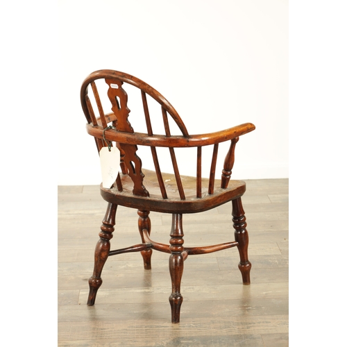 856 - A 19TH CENTURY CHILD'S YEW WOOD WINDSOR CHAIR with shaped cut-out back splat, saddle seat and turned... 