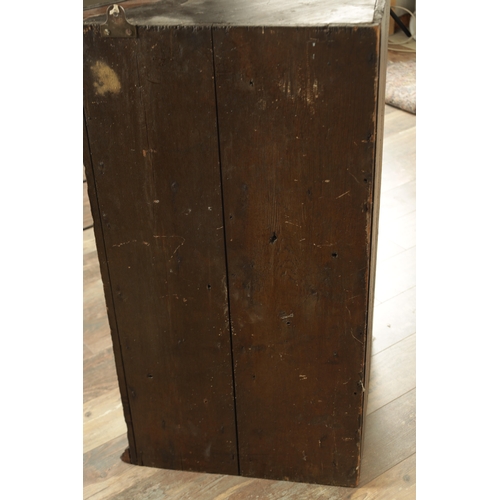 858 - A GOOD EARLY 18TH CENTURY WALNUT HANGING CORNER CUPBOARD with arched panelled door above a single dr... 