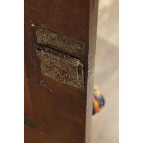 858 - A GOOD EARLY 18TH CENTURY WALNUT HANGING CORNER CUPBOARD with arched panelled door above a single dr... 