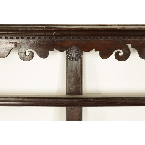 860 - A GEORGE III HANGING OAK DELFT RACK with dentil cornice and scroll-cut frieze centred by a shell abo... 