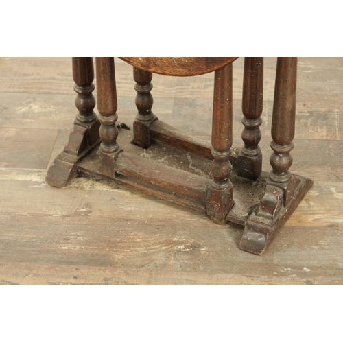 861 - A CHARLES II STYLE MINIATURE OAK DROP LEAF GATE LEG TABLE with turned supports and solid sledge base... 