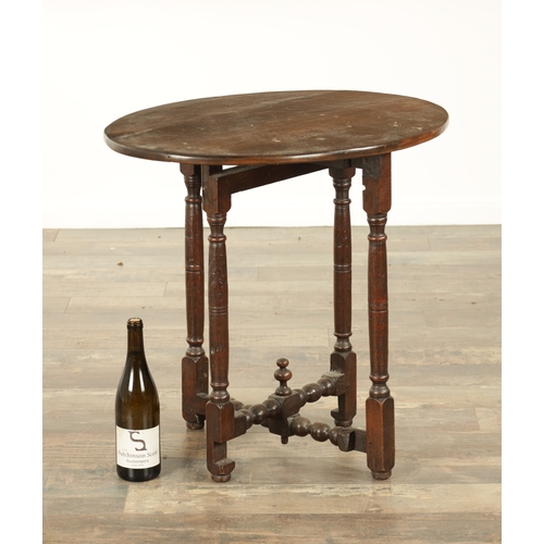 862 - AN EARLY 18TH CENTURY OAK FOLDING TAVERN TABLE with an oval top above a turned folding base (70cm wi... 