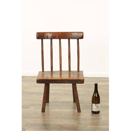 863 - A 19TH CENTURY ELM PRIMITIVE STICK BACK CHAIR with solid seat and square legs (46cm wide 75cm high )