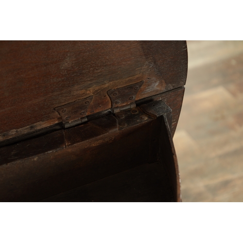 864 - AN EARLY 18TH CENTURY OAK DEMI LUNE SIDE TABLE with fold-down back and hinged top, raised on ring-tu... 