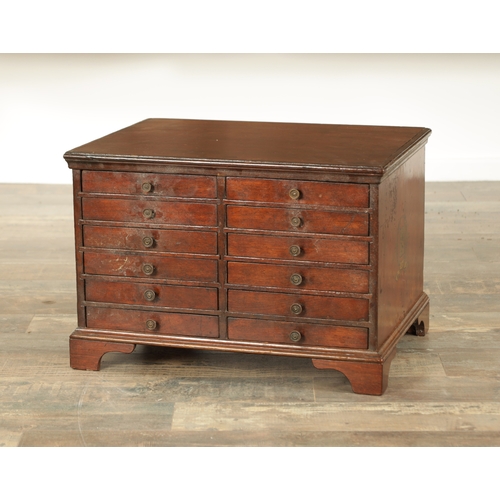 865 - A LATE GEORGIAN MAHOGANY COLLECTORS CABINET fitted two banks of six small drawers raised on bracket ... 