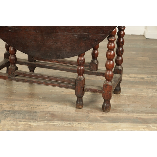 866 - AN EARLY 18TH CENTURY JOINED OAK GATE LEG TABLE the oval top on a bobbin-turned base with under stre... 