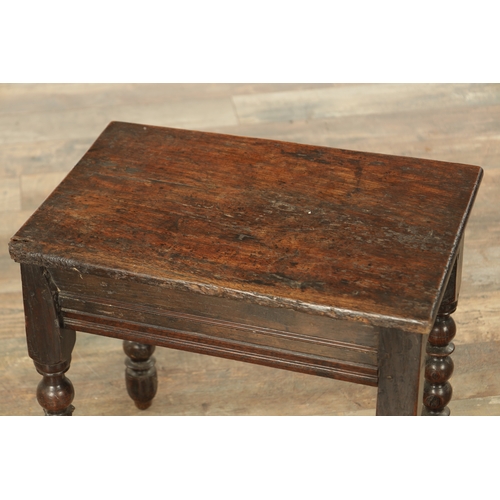 867 - A LATE 17TH CENTURY AND LATER OAK STOOL with plank top raised on ring turned leg supports (52cm wide... 