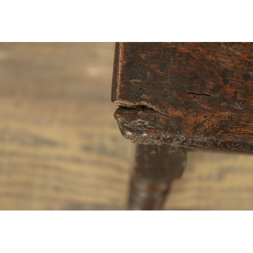 867 - A LATE 17TH CENTURY AND LATER OAK STOOL with plank top raised on ring turned leg supports (52cm wide... 