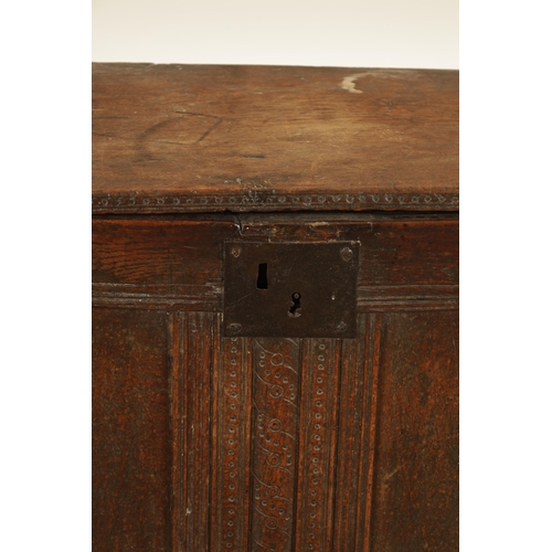 870 - A 17TH CENTURY SMALL NAILED PLANK COFFER the joined double panelled front with moulded borders and c... 