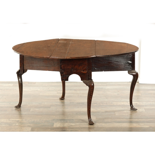 875 - AN EARLY QUEEN ANNE OAK GATE LEG TABLE with hinged drop sides, mounted on a square cut-out frieze ra... 