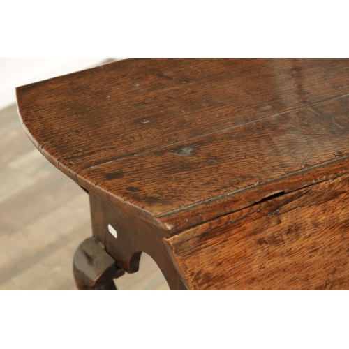 875 - AN EARLY QUEEN ANNE OAK GATE LEG TABLE with hinged drop sides, mounted on a square cut-out frieze ra... 