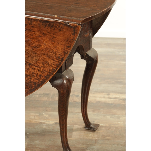 875 - AN EARLY QUEEN ANNE OAK GATE LEG TABLE with hinged drop sides, mounted on a square cut-out frieze ra... 