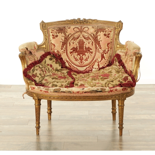 876 - A 19TH CENTURY FRENCH GILT WOOD LOVING SEAT with a leaf-carved frame and upholstered seat. (88cm wid... 