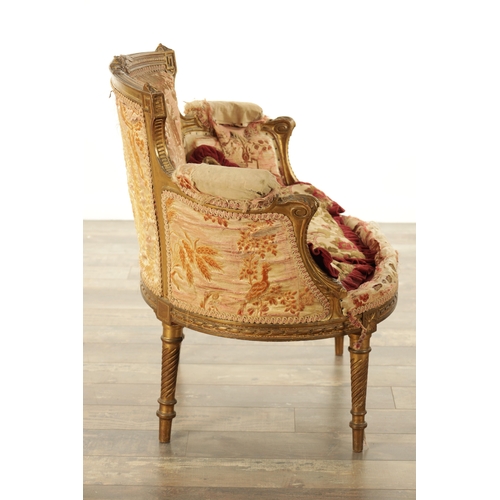 876 - A 19TH CENTURY FRENCH GILT WOOD LOVING SEAT with a leaf-carved frame and upholstered seat. (88cm wid... 