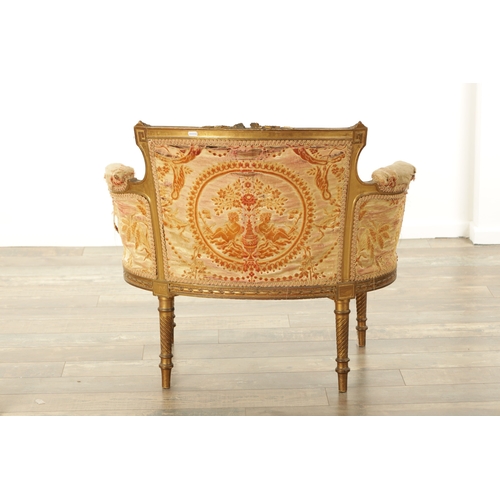 876 - A 19TH CENTURY FRENCH GILT WOOD LOVING SEAT with a leaf-carved frame and upholstered seat. (88cm wid... 