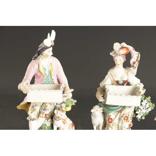 125 - A LATE 18TH CENTURY PAIR OF CHELSEA DERBY PORCELAIN FIGURES CARRYING BASKETS together with a derby d... 