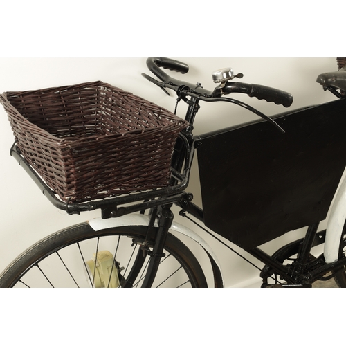 743 - A VINTAGE 1950'S DELIVERY/GROCERY TRADESMAN BICYCLE fitted with baskets to the front and back with a... 