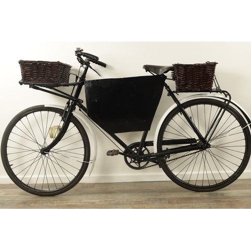 743 - A VINTAGE 1950'S DELIVERY/GROCERY TRADESMAN BICYCLE fitted with baskets to the front and back with a... 