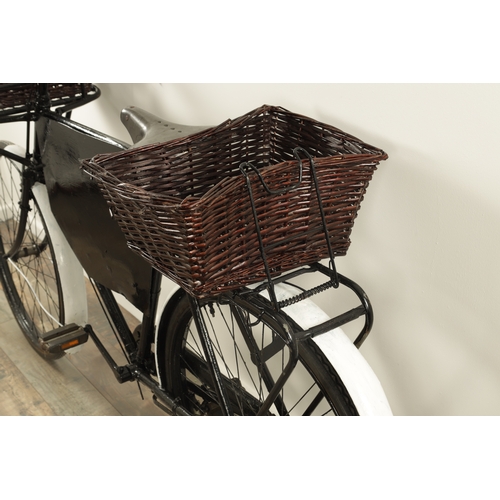 743 - A VINTAGE 1950'S DELIVERY/GROCERY TRADESMAN BICYCLE fitted with baskets to the front and back with a... 