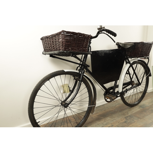 743 - A VINTAGE 1950'S DELIVERY/GROCERY TRADESMAN BICYCLE fitted with baskets to the front and back with a... 