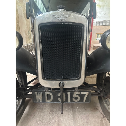 751 - A 1931 AUSTIN SALOON MOTOR CAR in need of restoration, original moroon and black paint and registrat... 