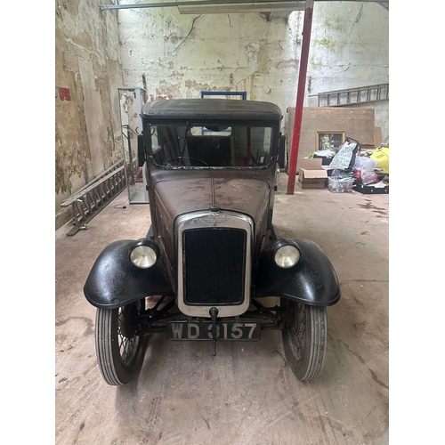 751 - A 1931 AUSTIN SALOON MOTOR CAR in need of restoration, original moroon and black paint and registrat... 