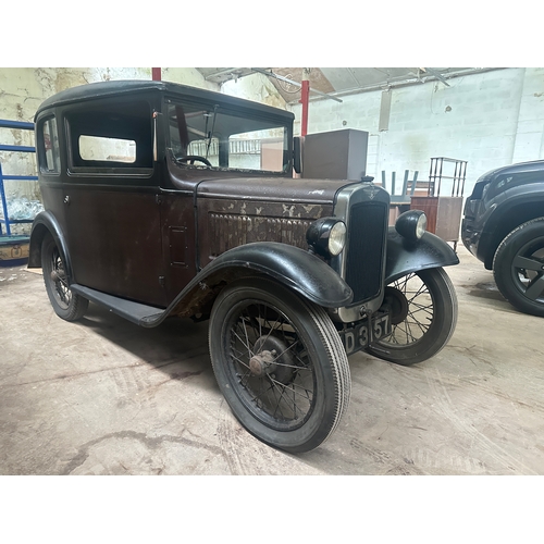 751 - A 1931 AUSTIN SALOON MOTOR CAR in need of restoration, original moroon and black paint and registrat... 