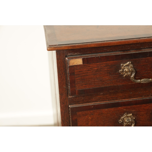 857 - A GEORGE III OAK AND WALNUT CROSS-BANDED CHEST OF DRAWERS with Rococo style gilt brass handles and b... 