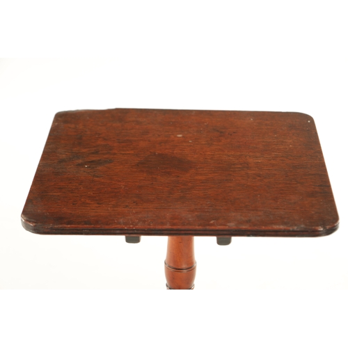 736 - A 19TH CENTURY MINIATURE FRUIT WOOD TILT TOP TABLE with turned stem and splayed tripod legs.