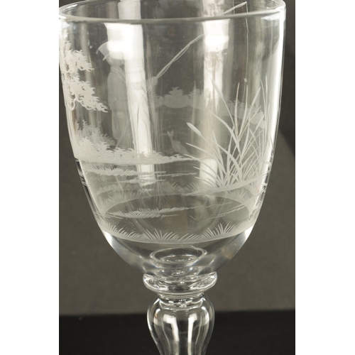 1 - A LATE GEORGIAN GIANT GLASS GOBLET with finely engraved angling and landscape scene on a ringed inve... 