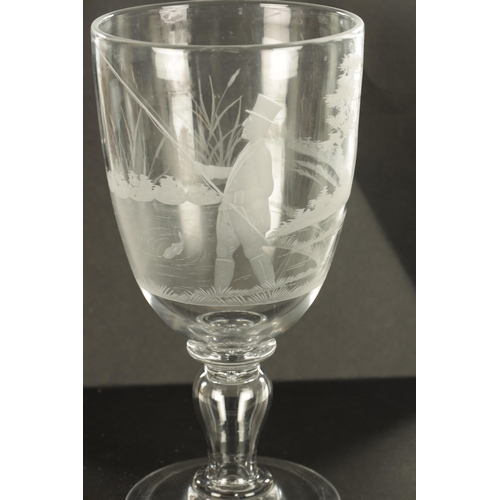 1 - A LATE GEORGIAN GIANT GLASS GOBLET with finely engraved angling and landscape scene on a ringed inve... 