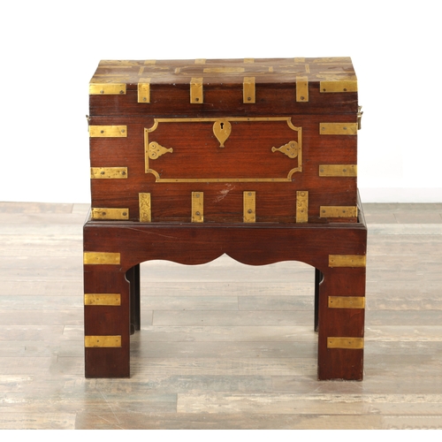 103 - AN 18TH CENTURY INDIAN HARDWOOD AND INLAID BRASS DRESSING BOX ON STAND with hinged top revealing a f... 