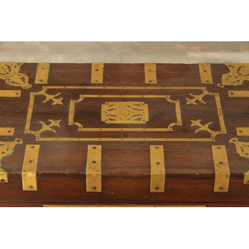 103 - AN 18TH CENTURY INDIAN HARDWOOD AND INLAID BRASS DRESSING BOX ON STAND with hinged top revealing a f... 