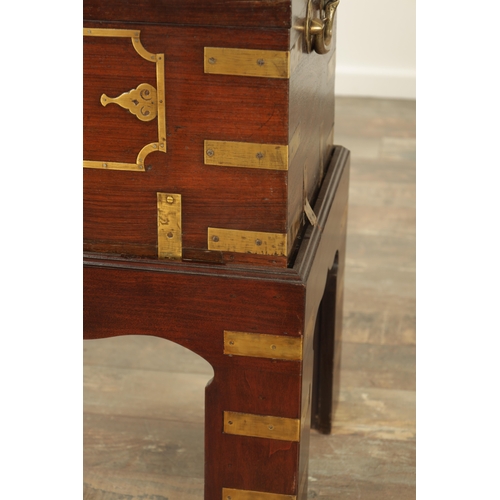 103 - AN 18TH CENTURY INDIAN HARDWOOD AND INLAID BRASS DRESSING BOX ON STAND with hinged top revealing a f... 