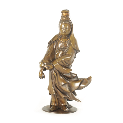 104 - A 19TH CENTURY CHINESE PATINATED BRONZE SCULPTURE figure of Guanyin with silvered hair and gilt high... 