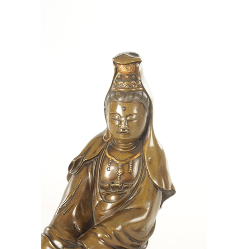 104 - A 19TH CENTURY CHINESE PATINATED BRONZE SCULPTURE figure of Guanyin with silvered hair and gilt high... 