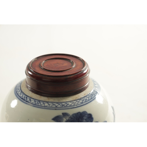 106 - AN EARLY CHINESE BLUE AND WHITE GINGER JAR WITH LATER HARDWOOD COVER of ovoid form, the body decorat... 