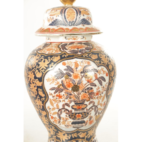 109 - A PAIR OF 19TH CENTURY STYLE IMARI VASES AND COVERS with polychrome coloured decoration and gilt hig... 